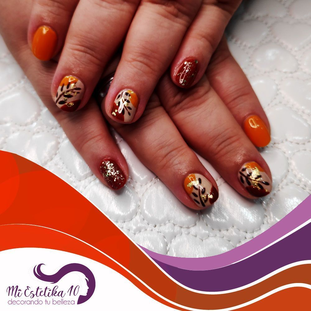 Unas-semipermanentes-florales-naranjas-y-rojas