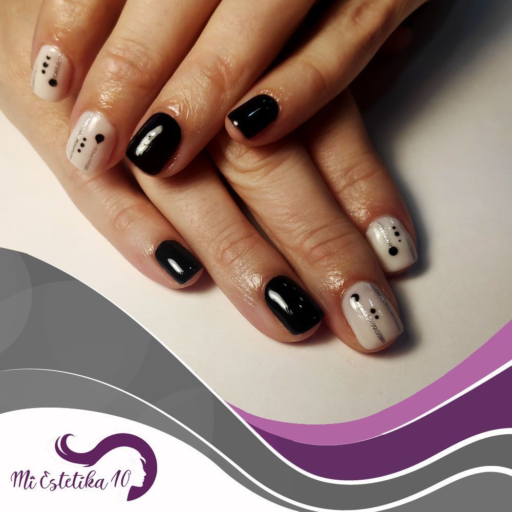 Unas-semipermanentes-blancas-y-negras-con-puntos-negros