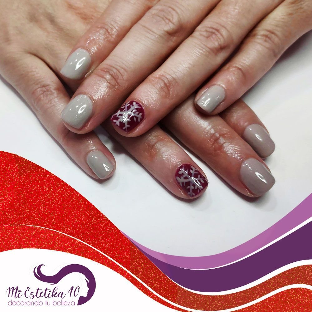 Unas-semipermanentes-grises-y-rojas-con-copo-de-nieve