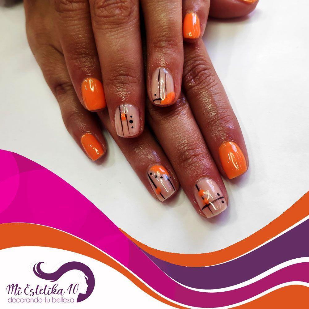 Unas-semipermanentes-naranjas-con-detalles-milimalistas